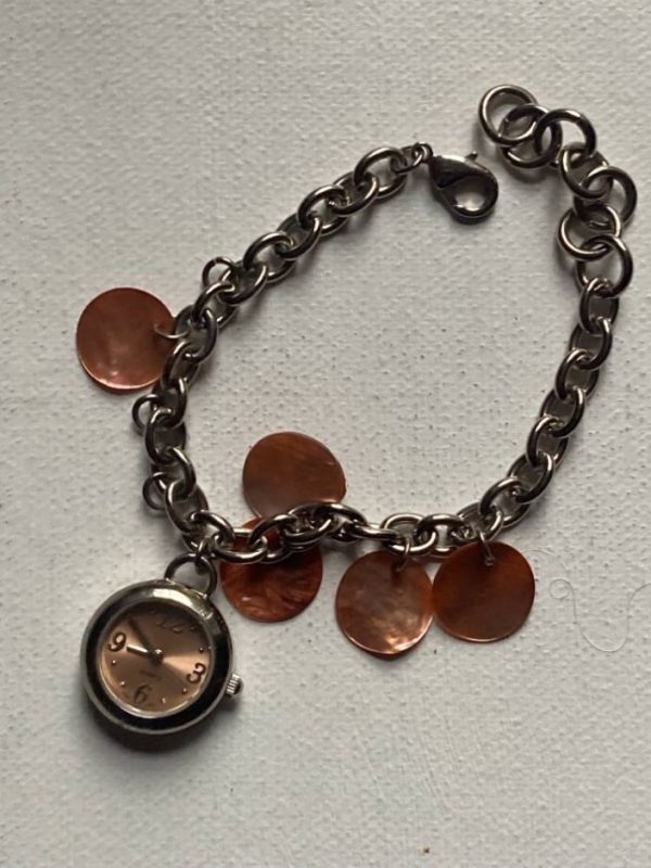 Avon Cosmetics Bracelet With Watch Charm In Silver Tone Metal.